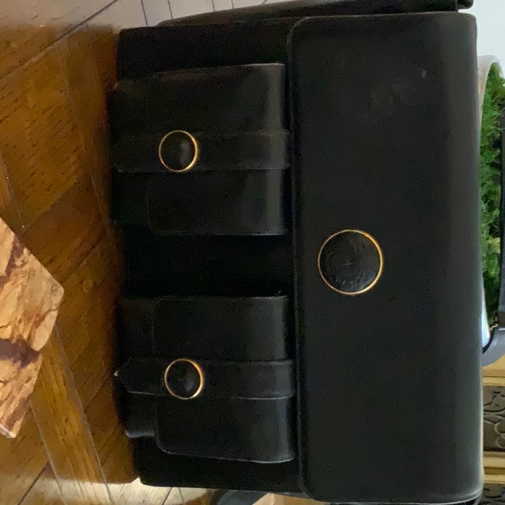 Selling a Gianni Versace original black bag with the Medusa embellishments